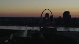 5.7K aerial stock footage pass the Gateway Geyser with view of Downtown St. Louis, Missouri, twilight Aerial Stock Footage | DX0001_000763