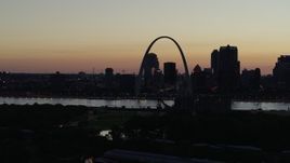 5.7K aerial stock footage of passing the Downtown St. Louis, Missouri skyline in silhouette at twilight Aerial Stock Footage | DX0001_000767