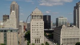 5.7K aerial stock footage of passing by courthouses to reveal the Gateway Arch in Downtown St. Louis, Missouri Aerial Stock Footage | DX0001_000775