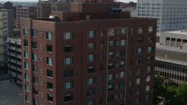 5.7K aerial stock footage orbit and reverse view of a brick office building in Downtown St. Louis, Missouri Aerial Stock Footage | DX0001_000800