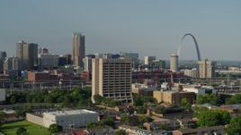 5.7K aerial stock footage of passing an office building with the Gateway Arch in background, Downtown St. Louis, Missouri Aerial Stock Footage | DX0001_000813
