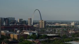 5.7K aerial stock footage of the Gateway Arch across the city seen while descending in Downtown St. Louis, Missouri Aerial Stock Footage | DX0001_000827
