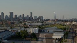 5.7K aerial stock footage a static view of the city's skyline and Gateway Arch seen from warehouses, Downtown St. Louis, Missouri Aerial Stock Footage | DX0001_000834