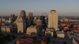 5.7K aerial stock footage of flying by courthouses to reveal Gateway Arch and museum at sunset, Downtown St. Louis, Missouri Aerial Stock Footage | DX0001_000845