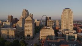 5.7K aerial stock footage flyby courthouse buildings and reveal Arch and museum at sunset, Downtown St. Louis, Missouri Aerial Stock Footage | DX0001_000849