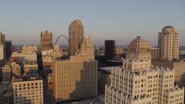 5.7K aerial stock footage flyby office building snd courthouse to reveal Arch at sunset, Downtown St. Louis, Missouri Aerial Stock Footage | DX0001_000851