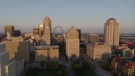 5.7K aerial stock footage of the Gateway Arch and museum seen from courthouses at sunset, Downtown St. Louis, Missouri Aerial Stock Footage | DX0001_000853