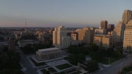 5.7K aerial stock footage fly over museum to approach a tall apartment building at sunset, Downtown St. Louis, Missouri Aerial Stock Footage | DX0001_000858