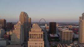5.7K aerial stock footage a view of the Arch over the top of a courthouse at sunset, Downtown St. Louis, Missouri Aerial Stock Footage | DX0001_000863