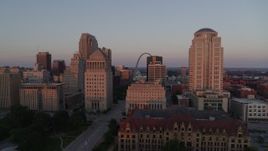 5.7K aerial stock footage of passing courthouses with view of the Arch, reveal city hall at sunset, Downtown St. Louis, Missouri Aerial Stock Footage | DX0001_000869