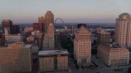 5.7K aerial stock footage of the Gateway Arch seen from the courthouses at sunset, Downtown St. Louis, Missouri Aerial Stock Footage | DX0001_000871