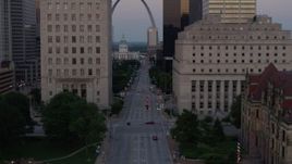5.7K aerial stock footage of light street traffic and courthouses, reveal the Gateway Arch at twilight, Downtown St. Louis, Missouri Aerial Stock Footage | DX0001_000882