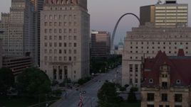 5.7K aerial stock footage flyby courthouses, reveal light street traffic, the Gateway Arch at twilight, Downtown St. Louis, Missouri Aerial Stock Footage | DX0001_000883