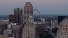 5.7K aerial stock footage fly past skyscrapers with a view of the Gateway Arch at twilight, Downtown St. Louis, Missouri Aerial Stock Footage | DX0001_000890