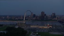 5.7K aerial stock footage of the Gateway Arch at twilight seen from across the Mississippi River, Downtown St. Louis, Missouri Aerial Stock Footage | DX0001_000897