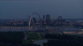 5.7K aerial stock footage of the Gateway Arch at twilight across the Mississippi River, Downtown St. Louis, Missouri Aerial Stock Footage | DX0001_000898