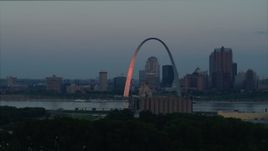 5.7K aerial stock footage of the Arch reflecting sunlight in Downtown St. Louis, Missouri, at sunrise Aerial Stock Footage | DX0001_000927