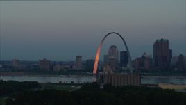 5.7K aerial stock footage of the Gateway Arch reflecting sunlight in Downtown St. Louis, Missouri, at sunrise Aerial Stock Footage | DX0001_000928