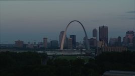 5.7K aerial stock footage of a view of the Gateway Arch reflecting sunlight in Downtown St. Louis, Missouri, at sunrise Aerial Stock Footage | DX0001_000929