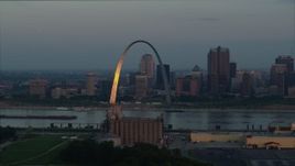 5.7K aerial stock footage of sunlight reflected off the Gateway Arch in Downtown St. Louis, Missouri, at sunrise Aerial Stock Footage | DX0001_000931
