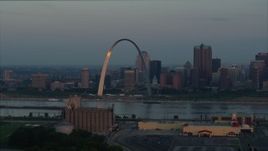 5.7K aerial stock footage the Gateway Arch reflecting sunlight in Downtown St. Louis, Missouri, at sunrise Aerial Stock Footage | DX0001_000932