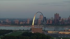 5.7K aerial stock footage of sunlight on the St. Louis Arch by the river at sunrise in Downtown St. Louis, Missouri Aerial Stock Footage | DX0001_000941