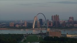 5.7K aerial stock footage of the St. Louis Arch beside the river at sunrise in Downtown St. Louis, Missouri Aerial Stock Footage | DX0001_000942