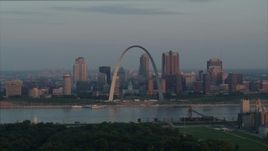 5.7K aerial stock footage of the St. Louis Arch overlooking the river at sunrise in Downtown St. Louis, Missouri Aerial Stock Footage | DX0001_000943