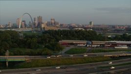 5.7K aerial stock footage pan across I-55 to reveal the Gateway Arch in the morning, Downtown St. Louis, Missouri Aerial Stock Footage | DX0001_000957