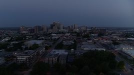 5.7K aerial stock footage of flying by the city skyline at twilight in Downtown Kansas City, Missouri Aerial Stock Footage | DX0001_000974