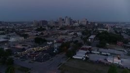 5.7K aerial stock footage of the city skyline at twilight, seen from industrial area in Downtown Kansas City, Missouri Aerial Stock Footage | DX0001_000976
