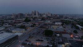 5.7K aerial stock footage fly over industrial area to approach skyline at twilight, Downtown Kansas City, Missouri Aerial Stock Footage | DX0001_000978