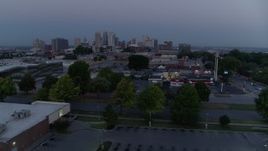 5.7K aerial stock footage of a view of skyline at twilight while descending to parking lot, Downtown Kansas City, Missouri Aerial Stock Footage | DX0001_000980