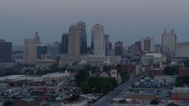 5.7K aerial stock footage of passing the city's tall skyscrapers at twilight in Downtown Kansas City, Missouri Aerial Stock Footage | DX0001_000983