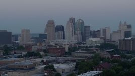5.7K aerial stock footage of the city's tall skyscrapers at twilight in Downtown Kansas City, Missouri Aerial Stock Footage | DX0001_000984