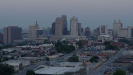 5.7K aerial stock footage of a reverse view of the city's tall skyscrapers at twilight in Downtown Kansas City, Missouri Aerial Stock Footage | DX0001_000986