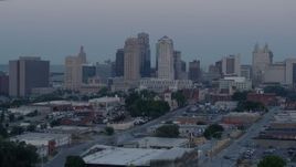 5.7K aerial stock footage of a slow approach to the city's tall skyscrapers at twilight in Downtown Kansas City, Missouri Aerial Stock Footage | DX0001_000987