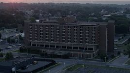 5.7K aerial stock footage of orbiting a brick office building at sunrise in Kansas City, Missouri Aerial Stock Footage | DX0001_000990