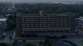 5.7K aerial stock footage of orbiting around a brick office building at sunrise in Kansas City, Missouri Aerial Stock Footage | DX0001_000991