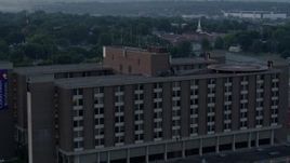 5.7K aerial stock footage of circling around a brick office building at sunrise in Kansas City, Missouri Aerial Stock Footage | DX0001_000992