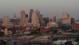 5.7K aerial stock footage of passing by the city skyline at sunrise, Downtown Kansas City, Missouri Aerial Stock Footage | DX0001_000994