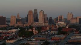 5.7K aerial stock footage of approaching the city skyline at sunrise, Downtown Kansas City, Missouri Aerial Stock Footage | DX0001_000996