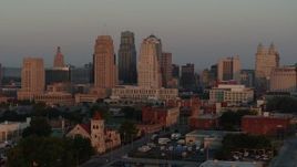 5.7K aerial stock footage slow approach and stationary view of the city skyline at sunrise, Downtown Kansas City, Missouri Aerial Stock Footage | DX0001_000997