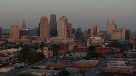 5.7K aerial stock footage fly to stationary view of the city skyline at sunrise, Downtown Kansas City, Missouri Aerial Stock Footage | DX0001_000999