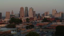 5.7K aerial stock footage ascend to reveal the city skyline at sunrise, Downtown Kansas City, Missouri Aerial Stock Footage | DX0001_001001