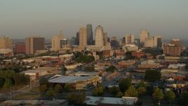 5.7K aerial stock footage flyby and away from the city skyline at sunrise, seen from east of the city, Downtown Kansas City, Missouri Aerial Stock Footage | DX0001_001009