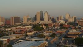 5.7K aerial stock footage approach the city skyline at sunrise from east of the city, Downtown Kansas City, Missouri Aerial Stock Footage | DX0001_001010