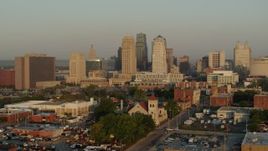5.7K aerial stock footage approach the city skyline at sunrise from east of the city, pause for static view, Downtown Kansas City, Missouri Aerial Stock Footage | DX0001_001011