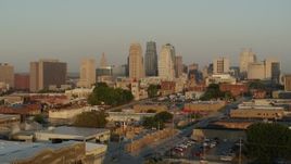 5.7K aerial stock footage of a view of the city skyline at sunrise while descending, Downtown Kansas City, Missouri Aerial Stock Footage | DX0001_001013