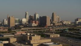 5.7K aerial stock footage approach the downtown skyline and Hwy 71 at sunrise, Downtown Kansas City, Missouri Aerial Stock Footage | DX0001_001020